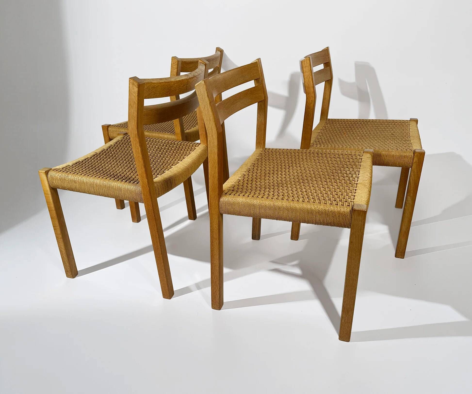 Dining chairs J.H. Møller model 401 in oak with original Danish cord — Denmark, 1970s