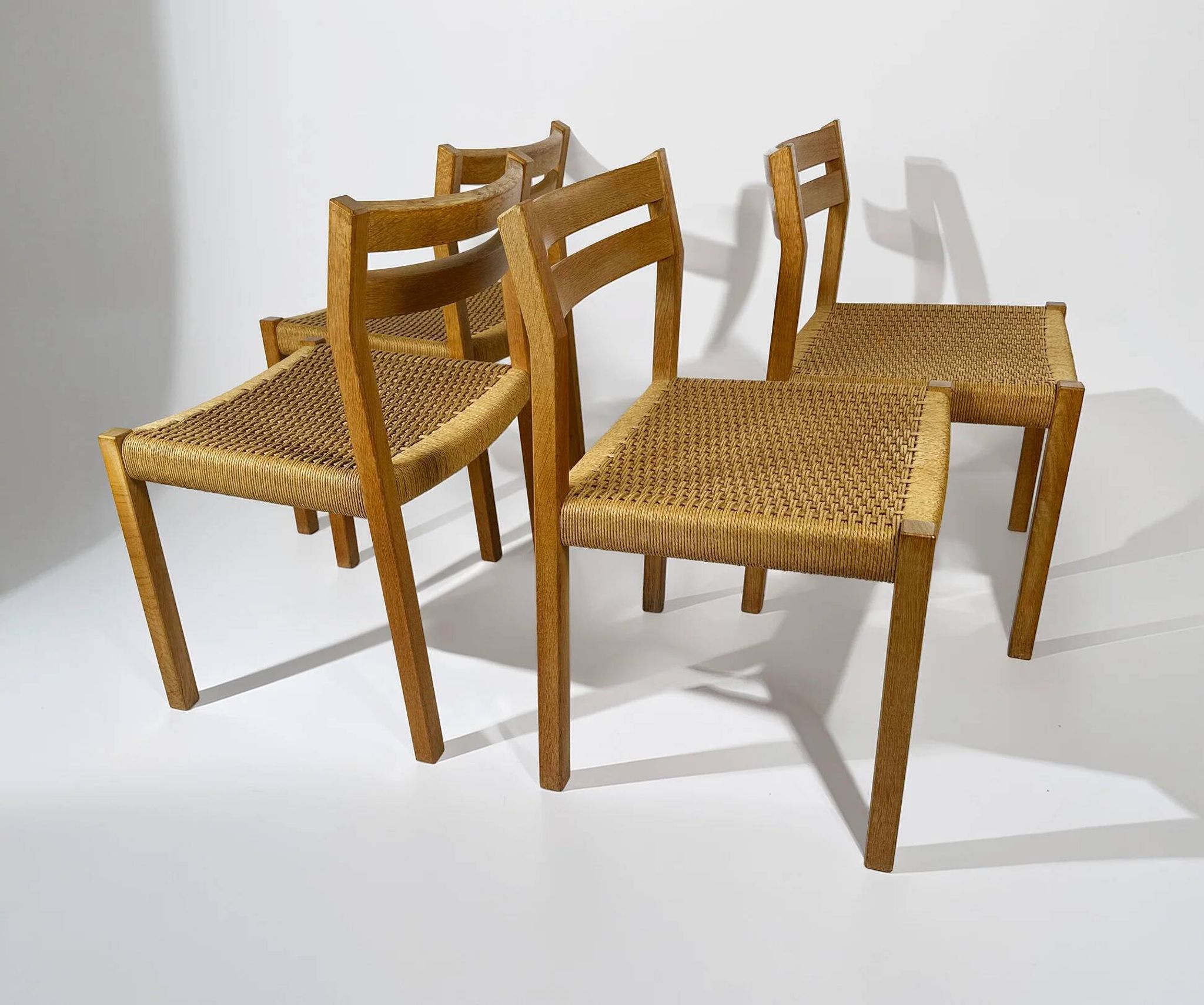 Dining chairs J.H. Møller model 401 in oak with original Danish cord — Denmark, 1970s