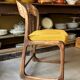 Chaise Baumann modèle "Traîneau" en bois foncé et coton ocre
