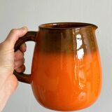 Orange ceramic pitcher
