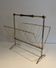 Brass and wood magazine rack, in the style of Cesare Lacca.