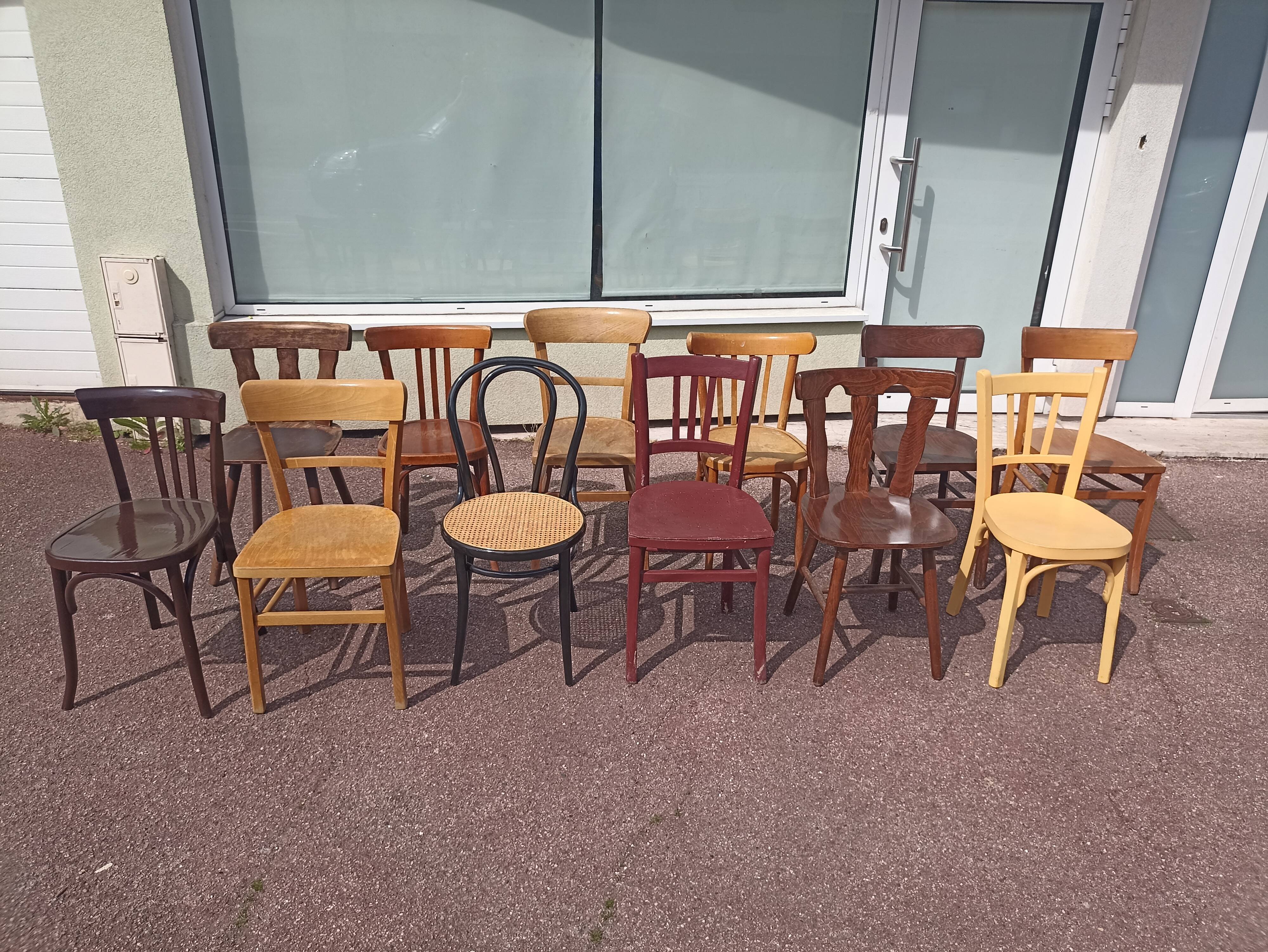Set of 12 mismatched wooden bistro chairs