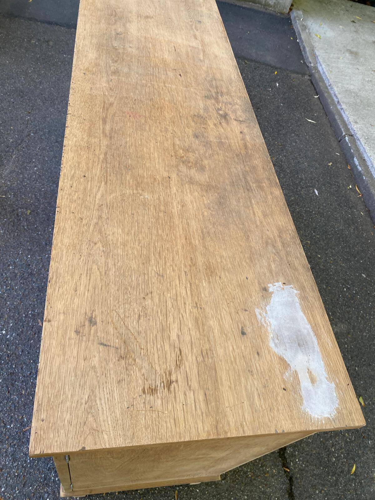 Vintage 1950s oak enfilade buffet with tapered legs.