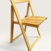 Blonde wooden folding chair in the style of Aldo Jacober.