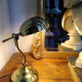 Articulated shell lamp in gold metal