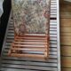 Wooden footrest and vintage tapestry