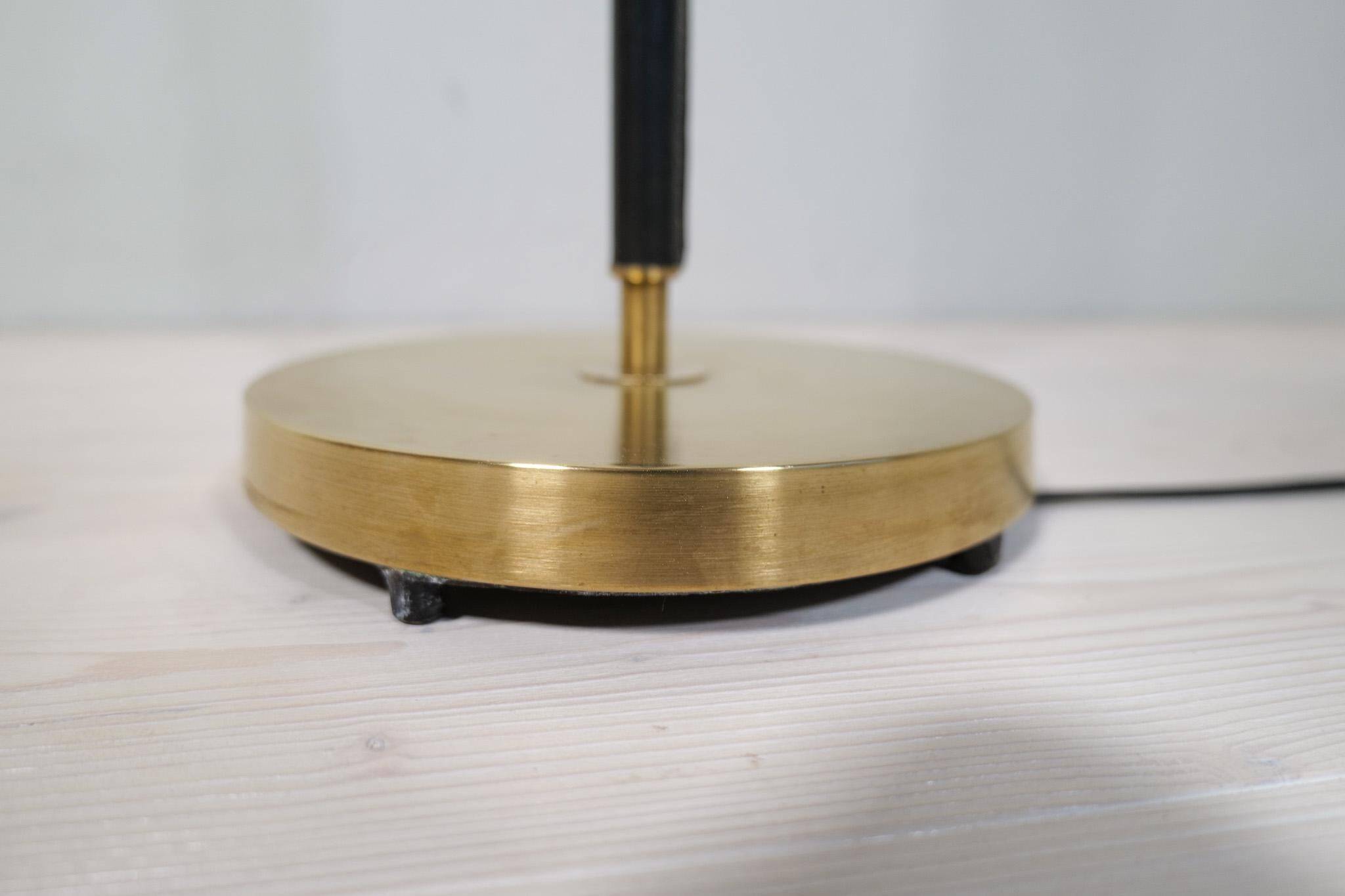 Mid-century black leather and brass floor lamp by Falkenbergs Belysning, Sweden, 1960s.