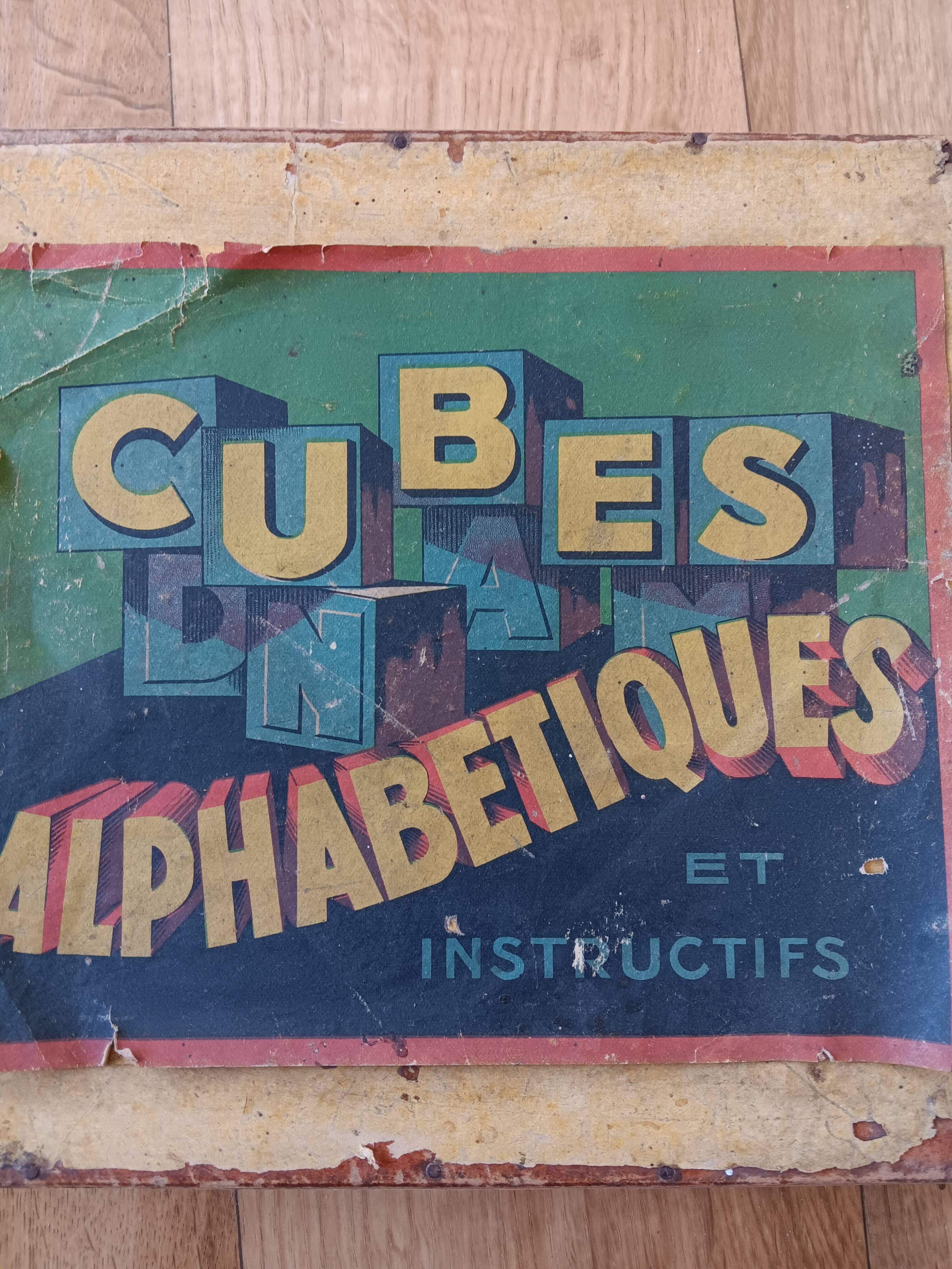 Instructional alphabetical cubes from the early 20th century.
