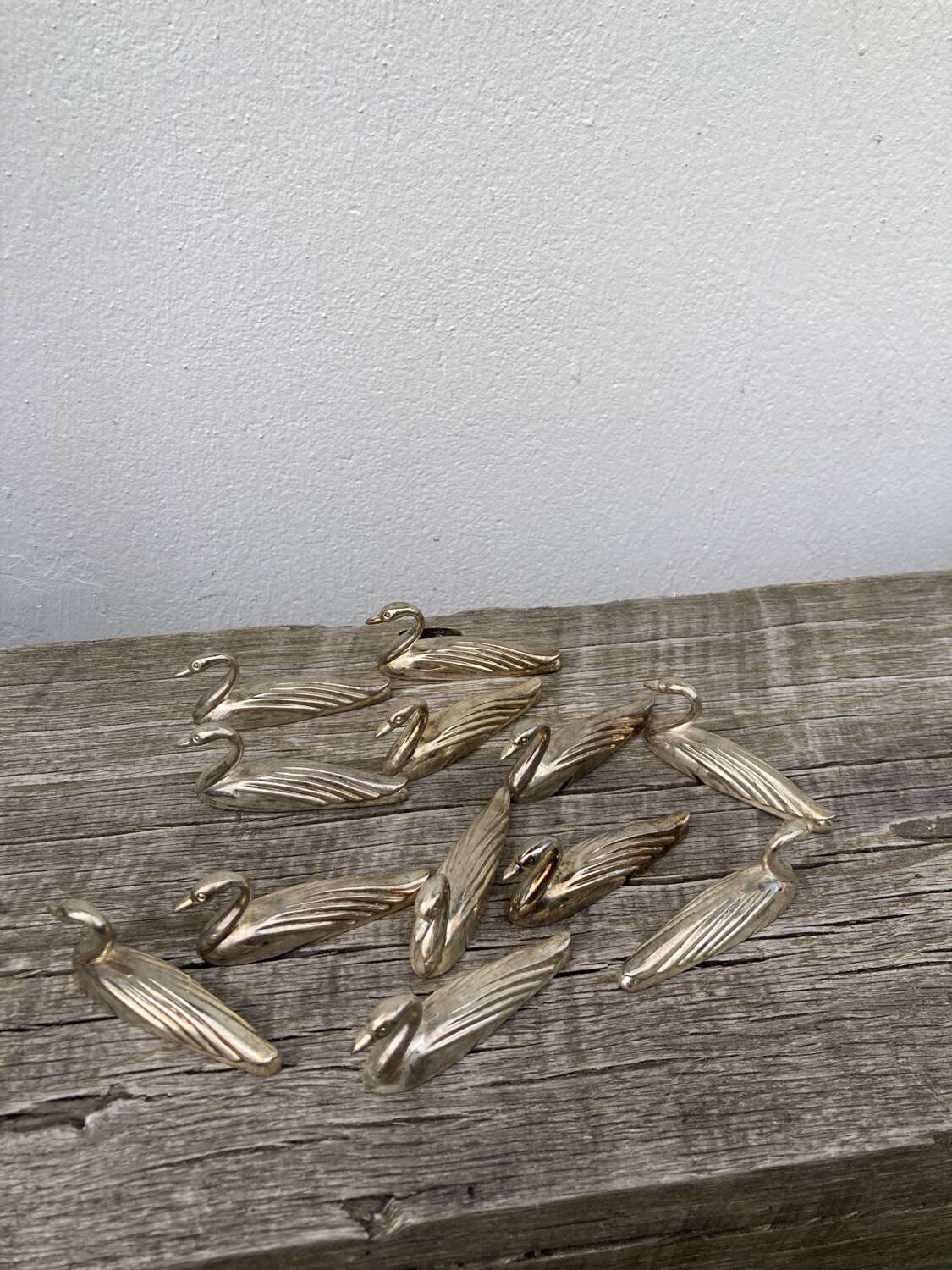 12 duck knife holders in silver metal