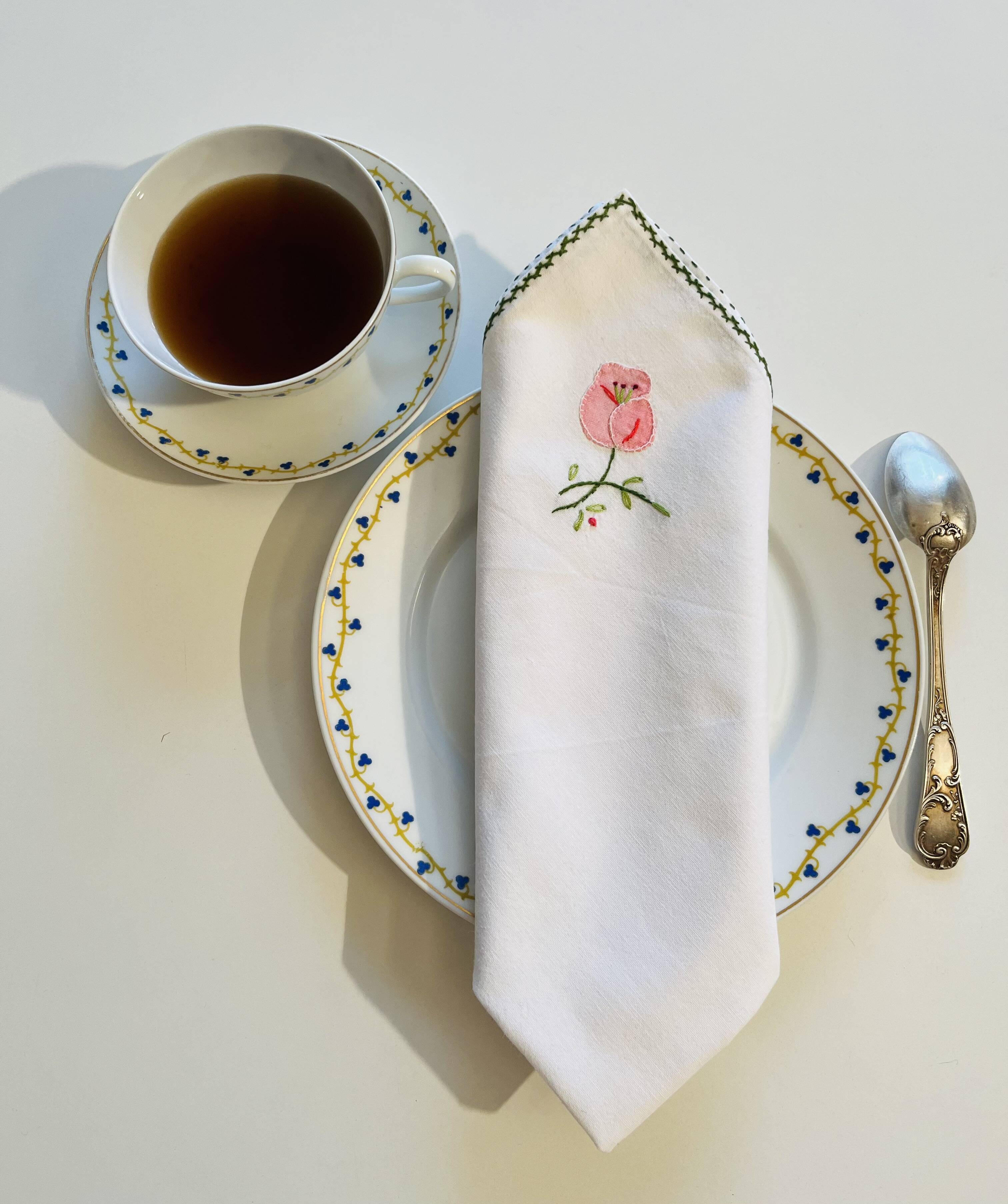 Set of 12 vintage hand-embroidered cotton white napkins.