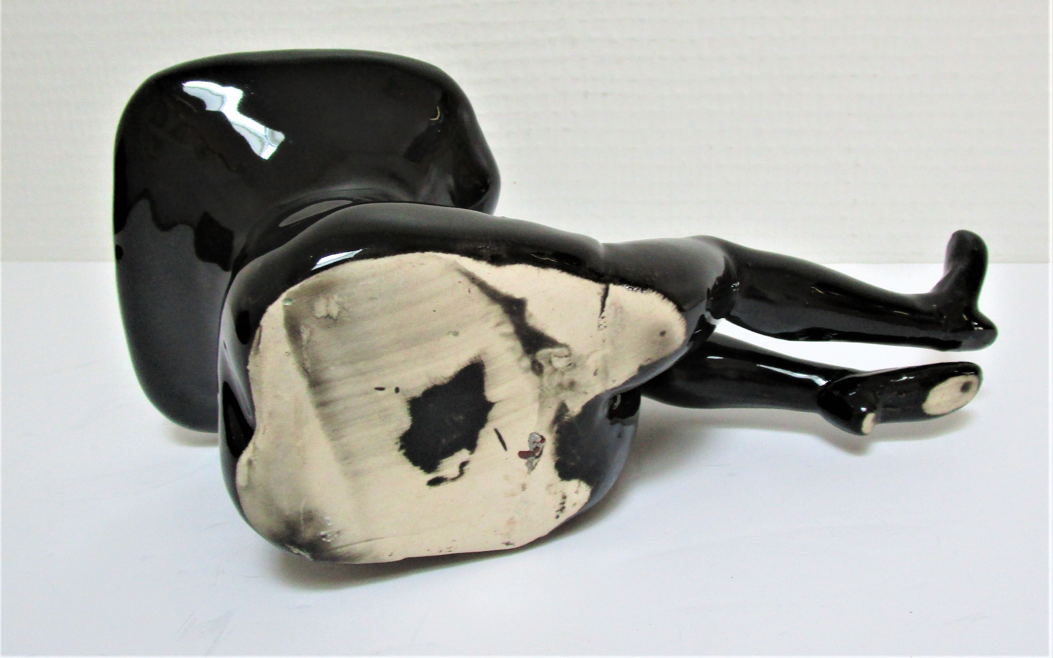 Anthropomorphic ashtray legs ceramic black design 80s