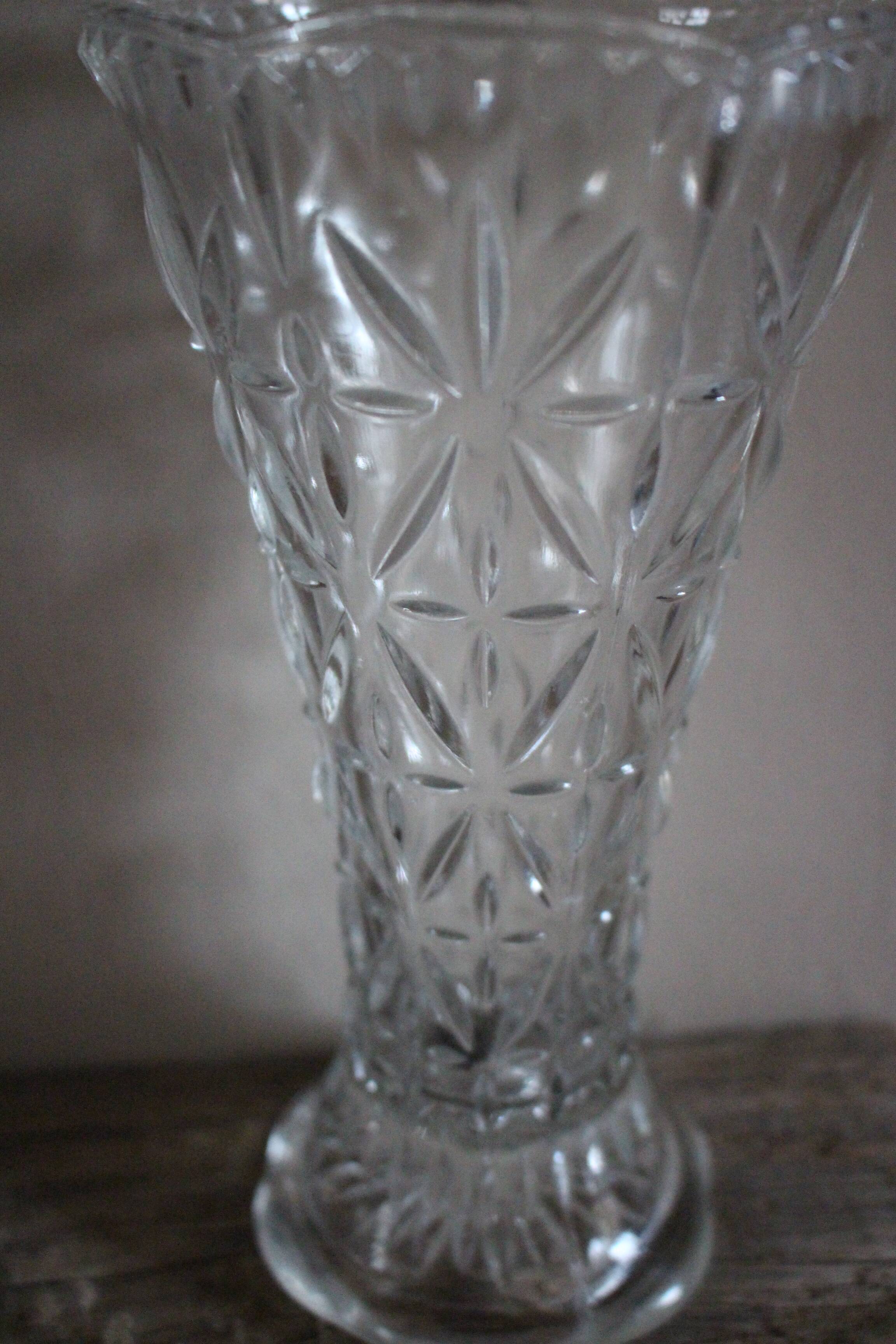 Transparent carved glass vase flowers