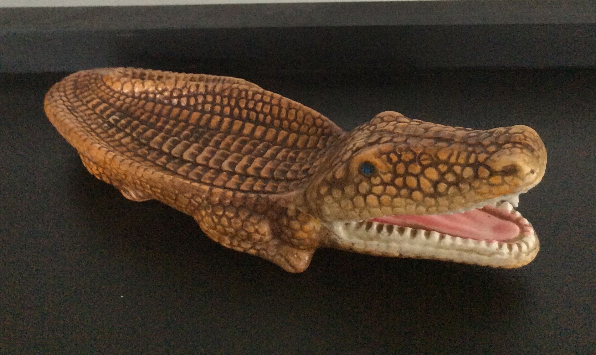 Empty vintage ceramic crocodile pocket