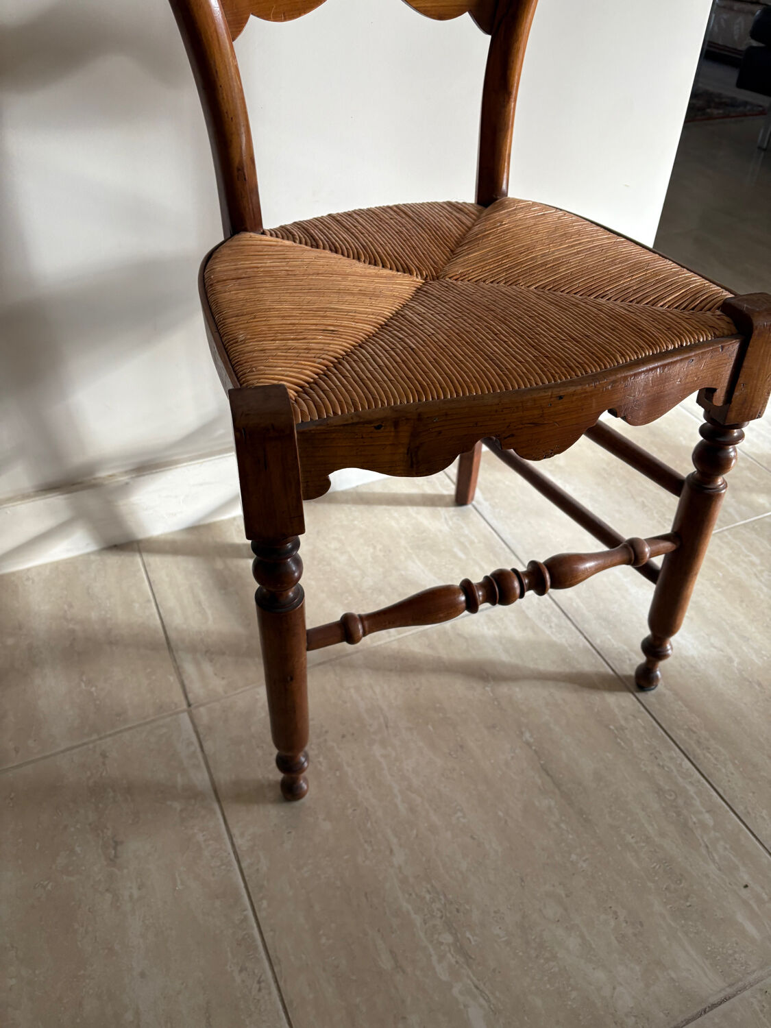 Antique wooden chair with woven straw seat – rustic style