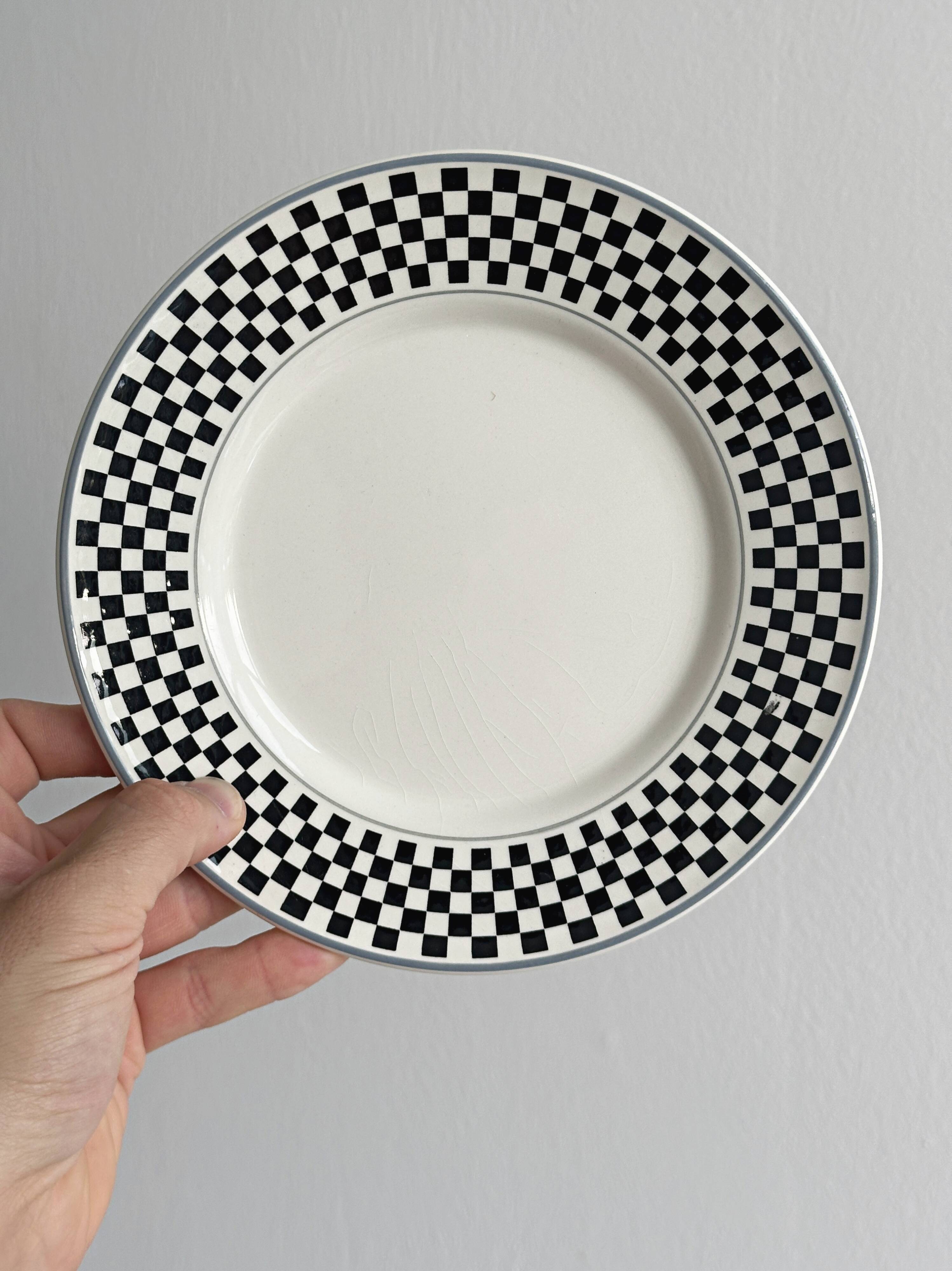 Pair of vintage plates with a black and white checkered pattern.