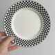 Pair of vintage plates with a black and white checkered pattern.