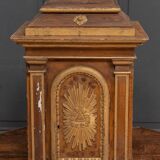 18th century tabernacle decorated with 2 columns and a sun on the facade