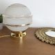 Globe old art deco table lamp in glass and brass support