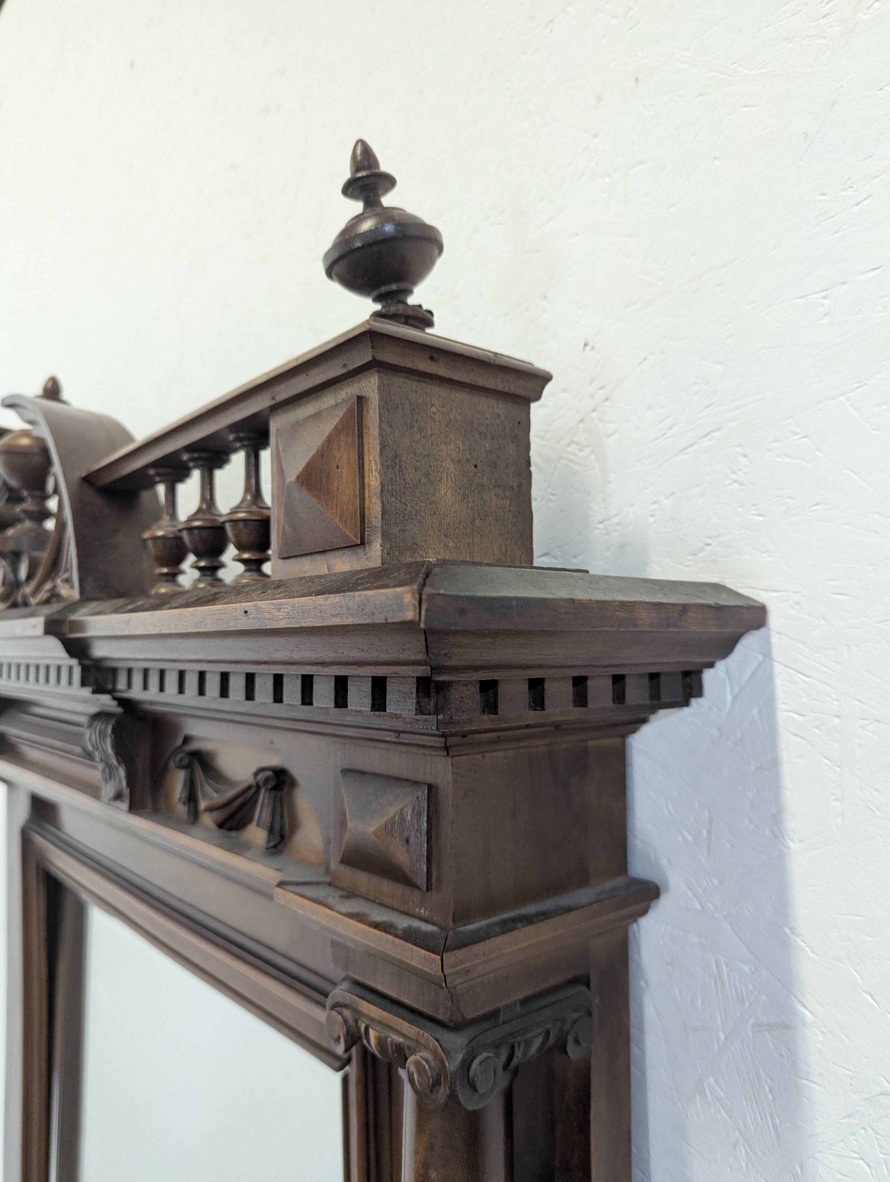 Large Renaissance-style mirror in solid walnut