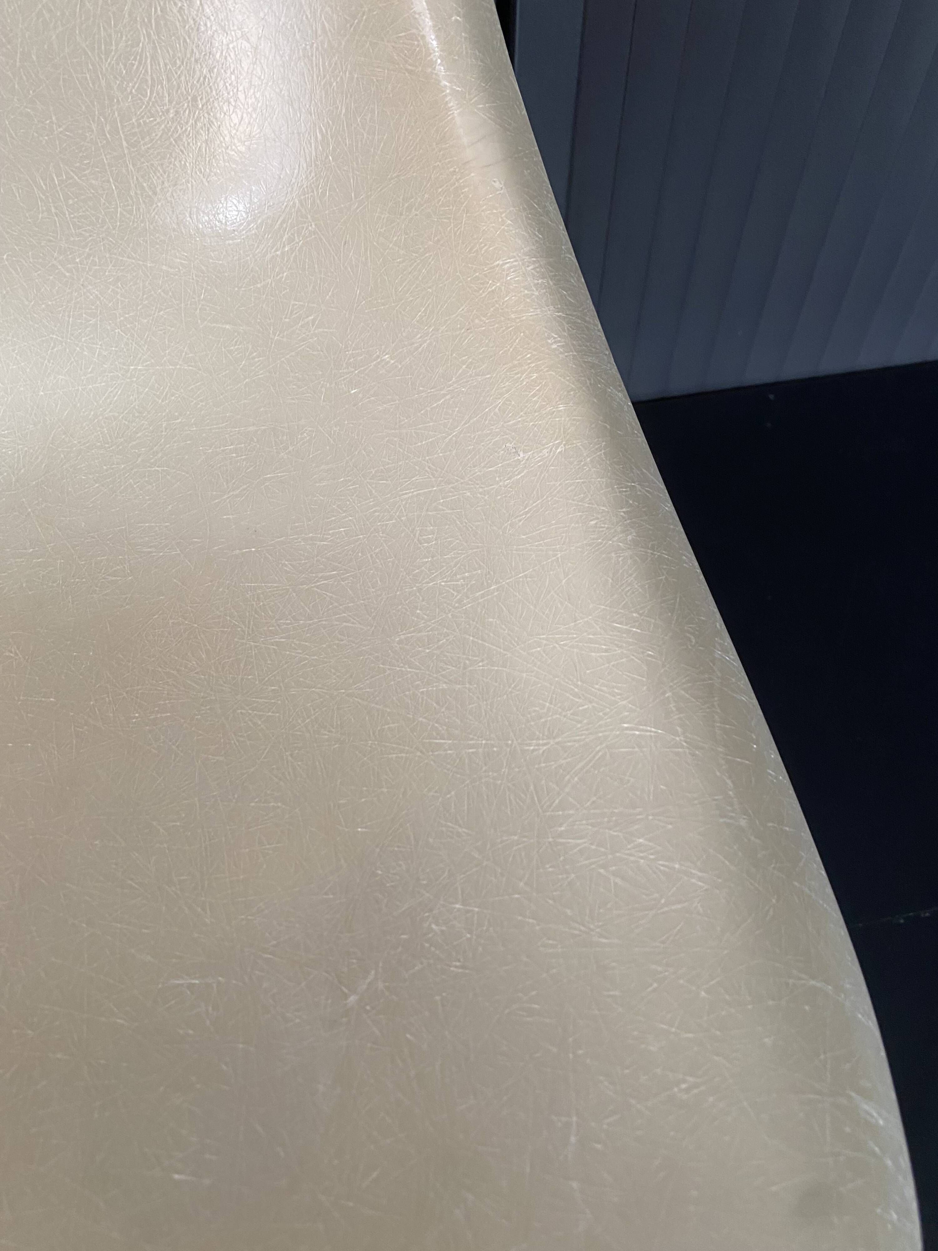 Eames lounge chair white fibre parchment base cat’s cradle Herman Miller