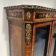 Napoleon III display cabinet in rosewood veneer and marquetry, 19th century.