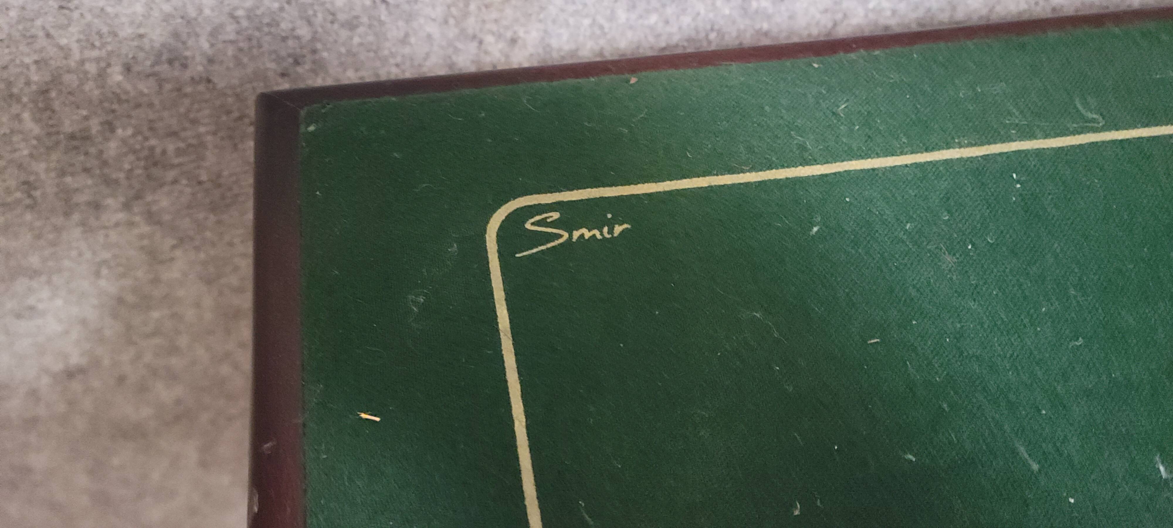 a wooden Bridge game table resting on four thin, straight legs