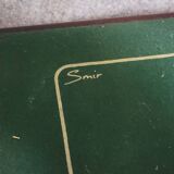 a wooden Bridge game table resting on four thin, straight legs