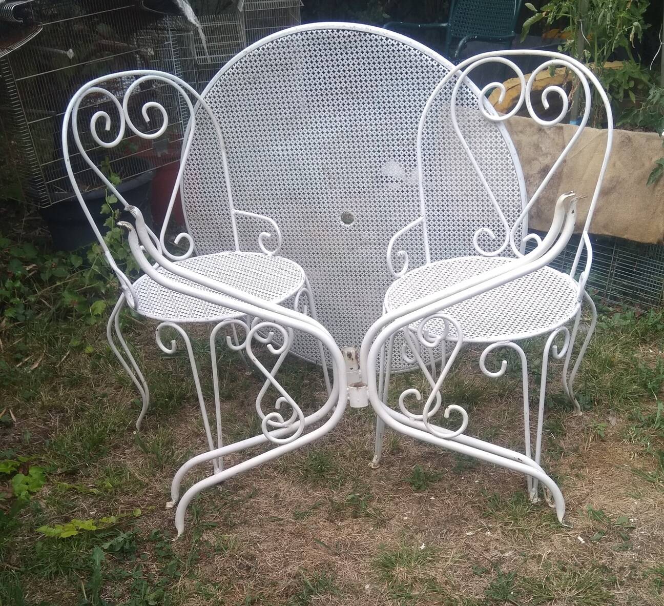 Mategot-style perforated wrought iron garden furniture with table and armchairs