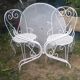 Mategot-style perforated wrought iron garden furniture with table and armchairs