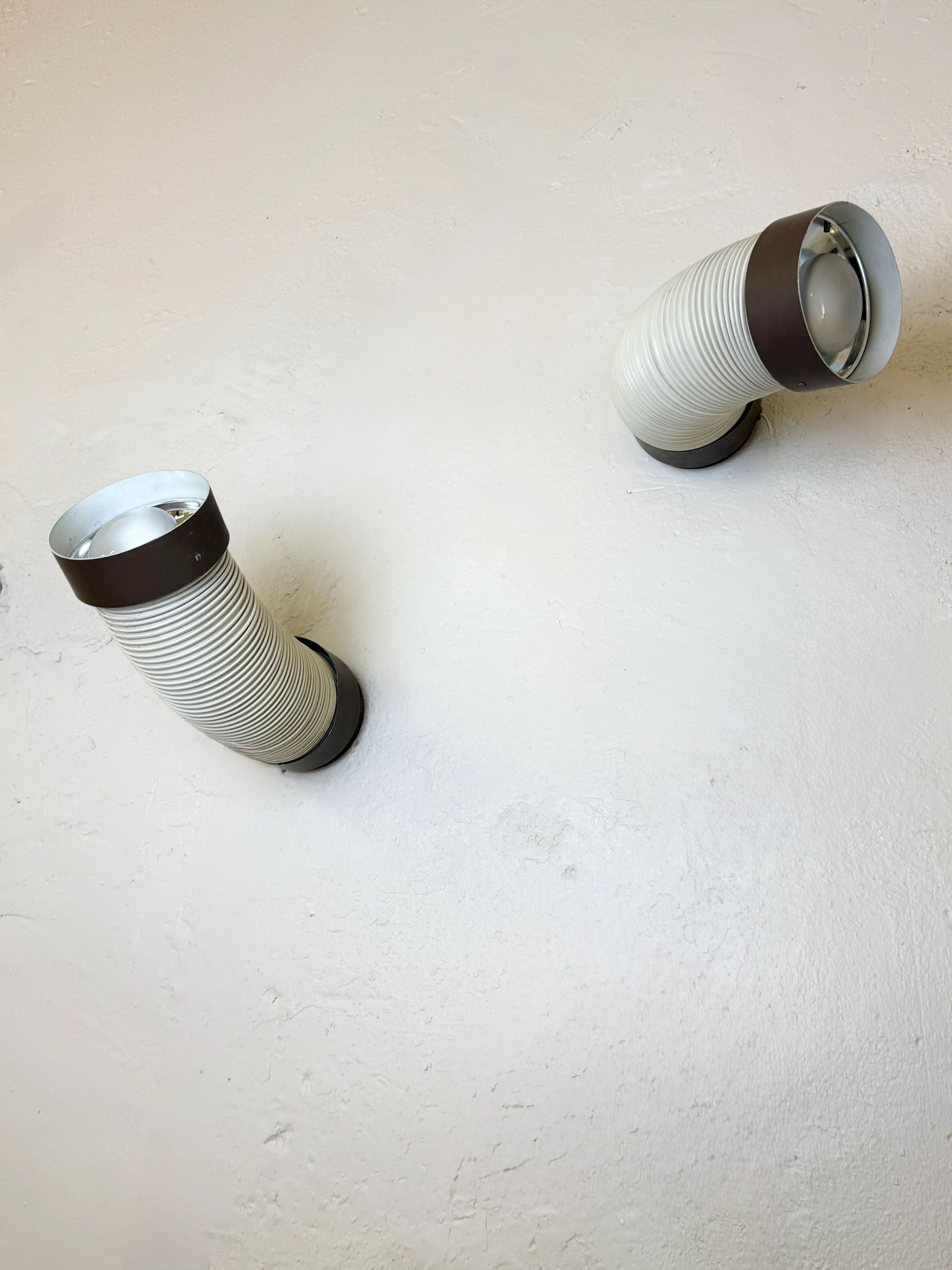 Pair of adjustable wall lights "Tuyau" by Raak, 1970s