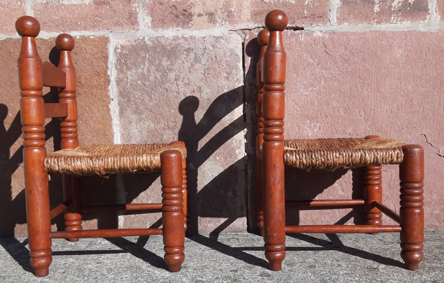 Pair of low armchairs by the fireplace. (Straw seat)