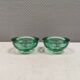 Un ensemble de porte-bougies iittala en verre transparent vert.