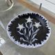 Black ceramic plate from the 60s