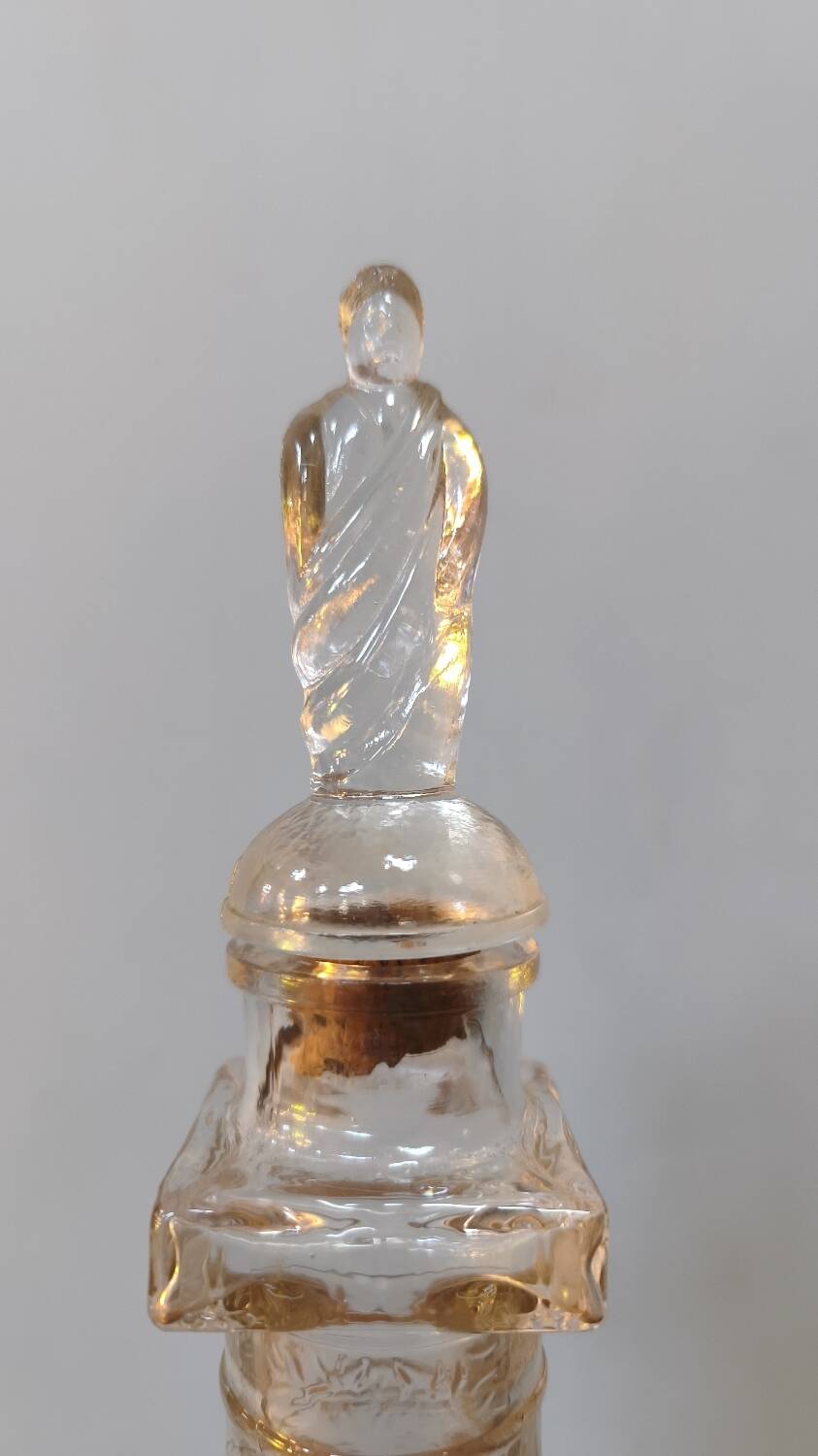Vendôme column perfume bottle in moulded glass, 19th century.