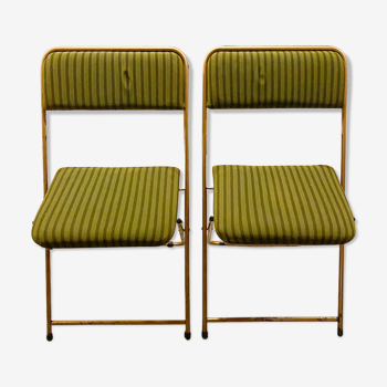 Two green and golden chairs