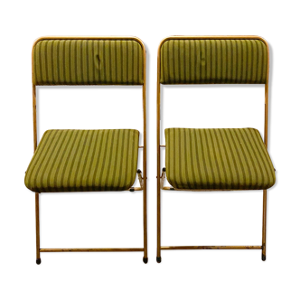 Two green and golden chairs