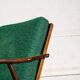 Boomerang chair in green fabric