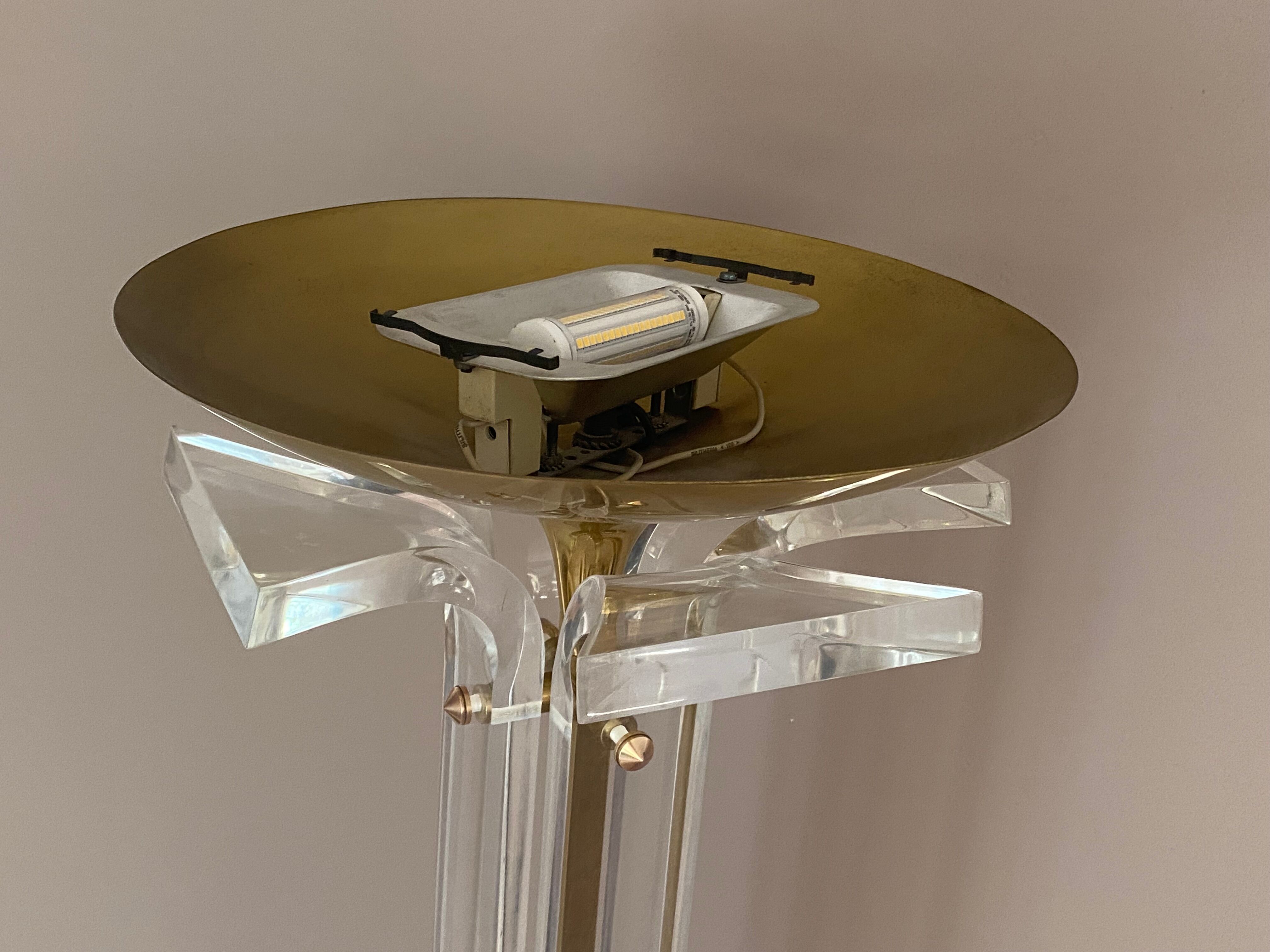 Plexiglass and brass floor lamp. 1970. Italy.
