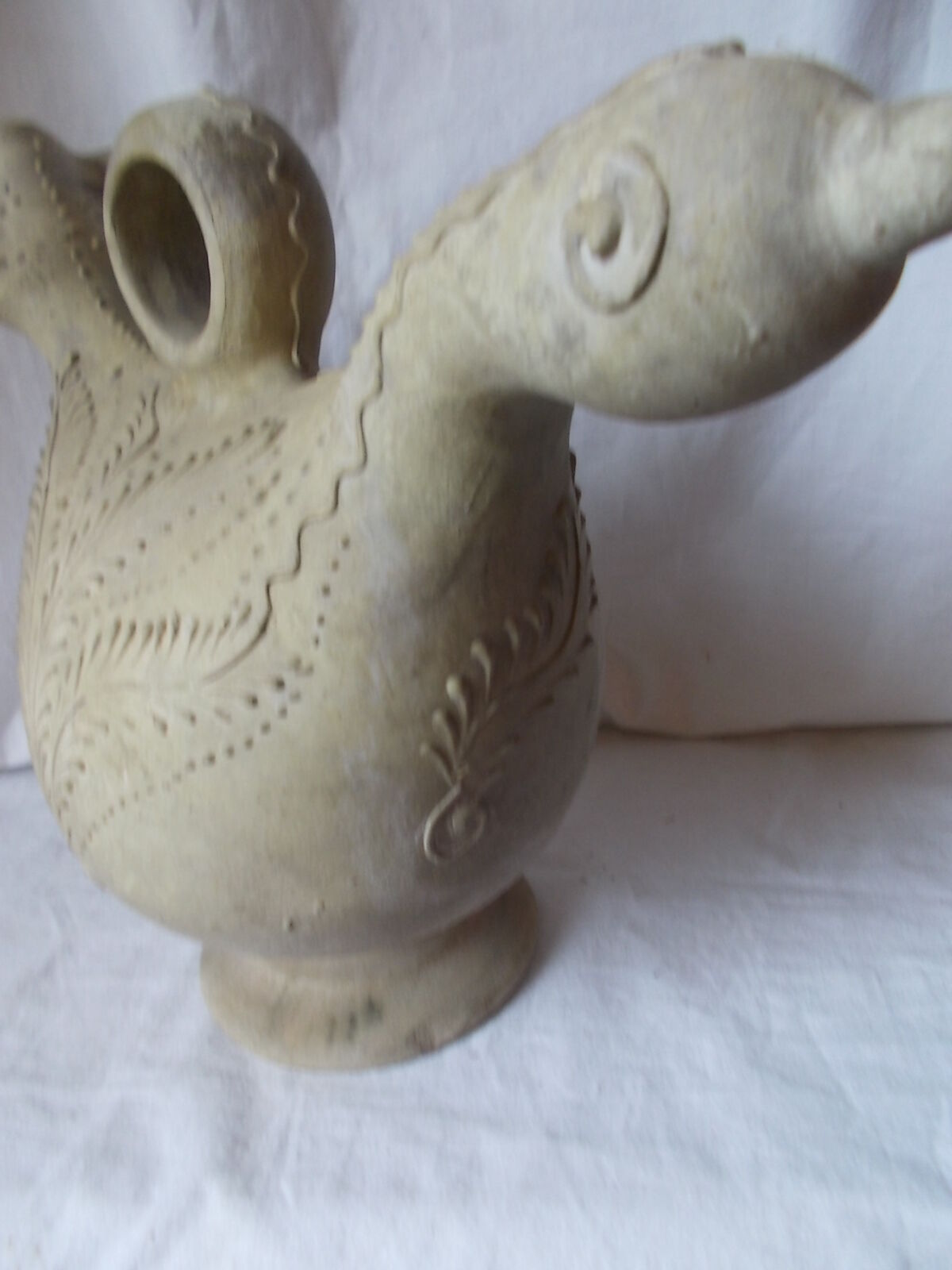 Old grey terracotta jug