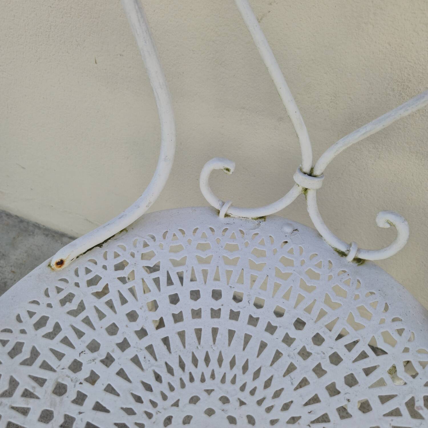 Pair of wrought iron garden chairs, antique manufacture