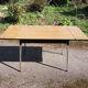 4 old chairs and an extendable table in 'faux wood' formica.