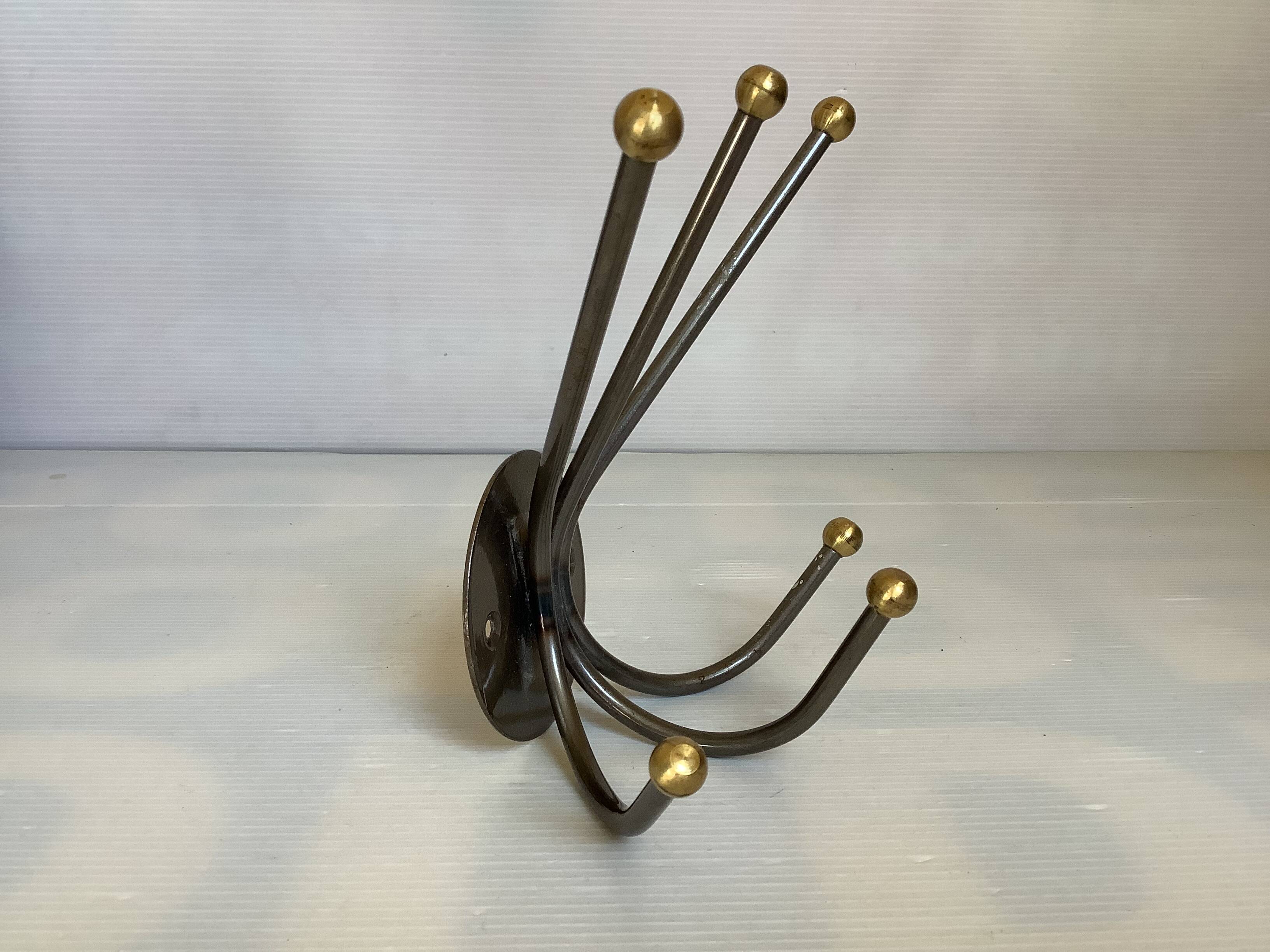 Small metal coat rack with six hooks