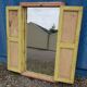 Old polychrome Burmese teak window with interior mirror.