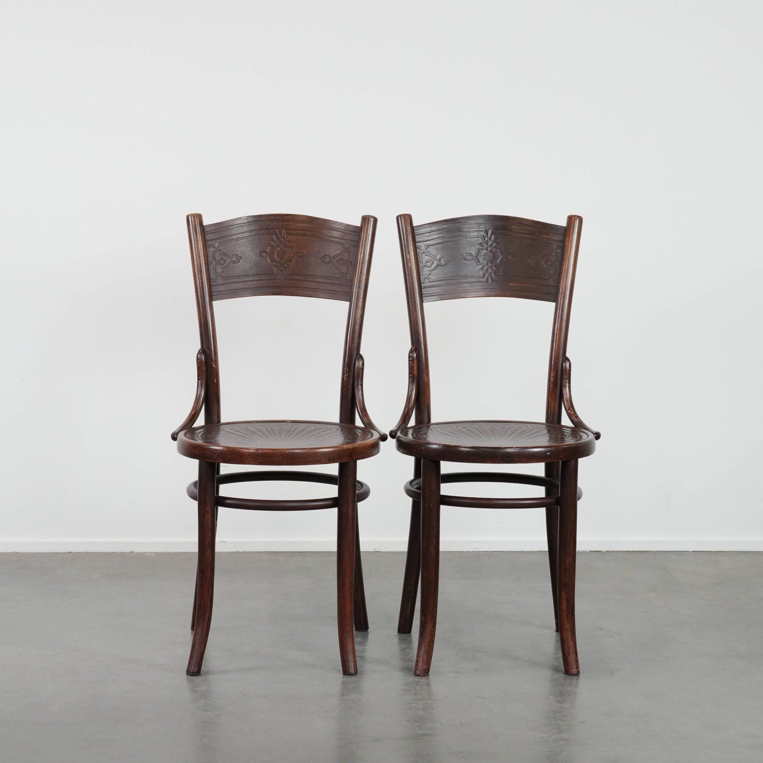 Set of two timeless vintage wooden Cosmos bistro design chairs