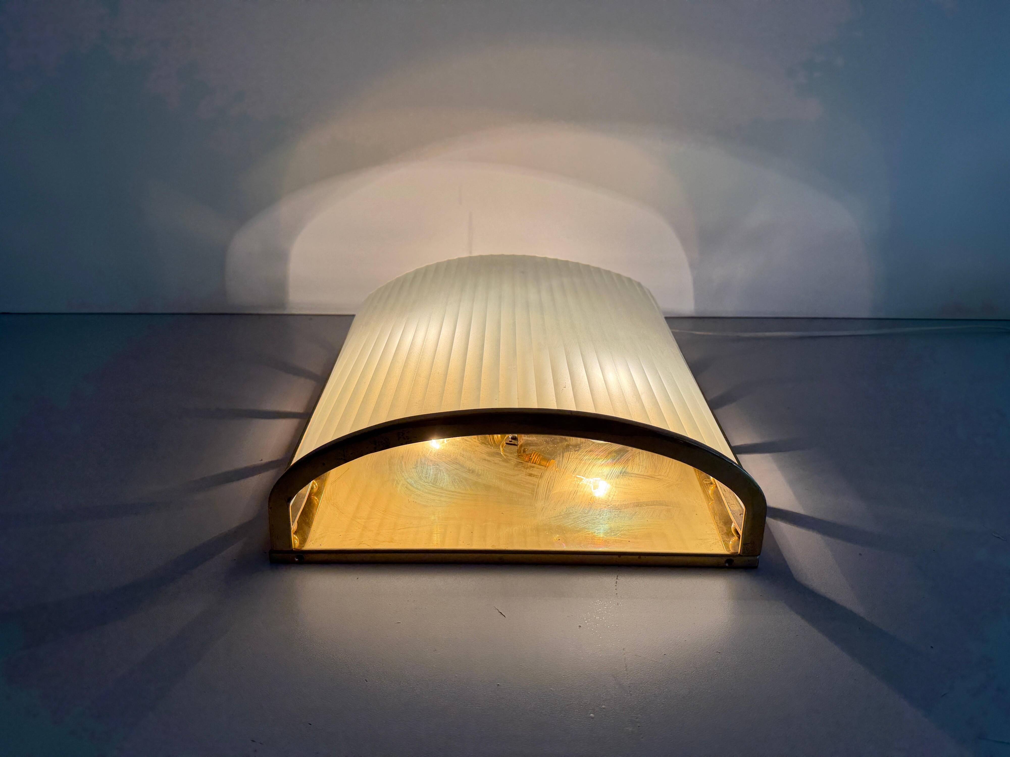 Large heavy glass wall light with a brass frame from the mid-century, 1950s, Italy.