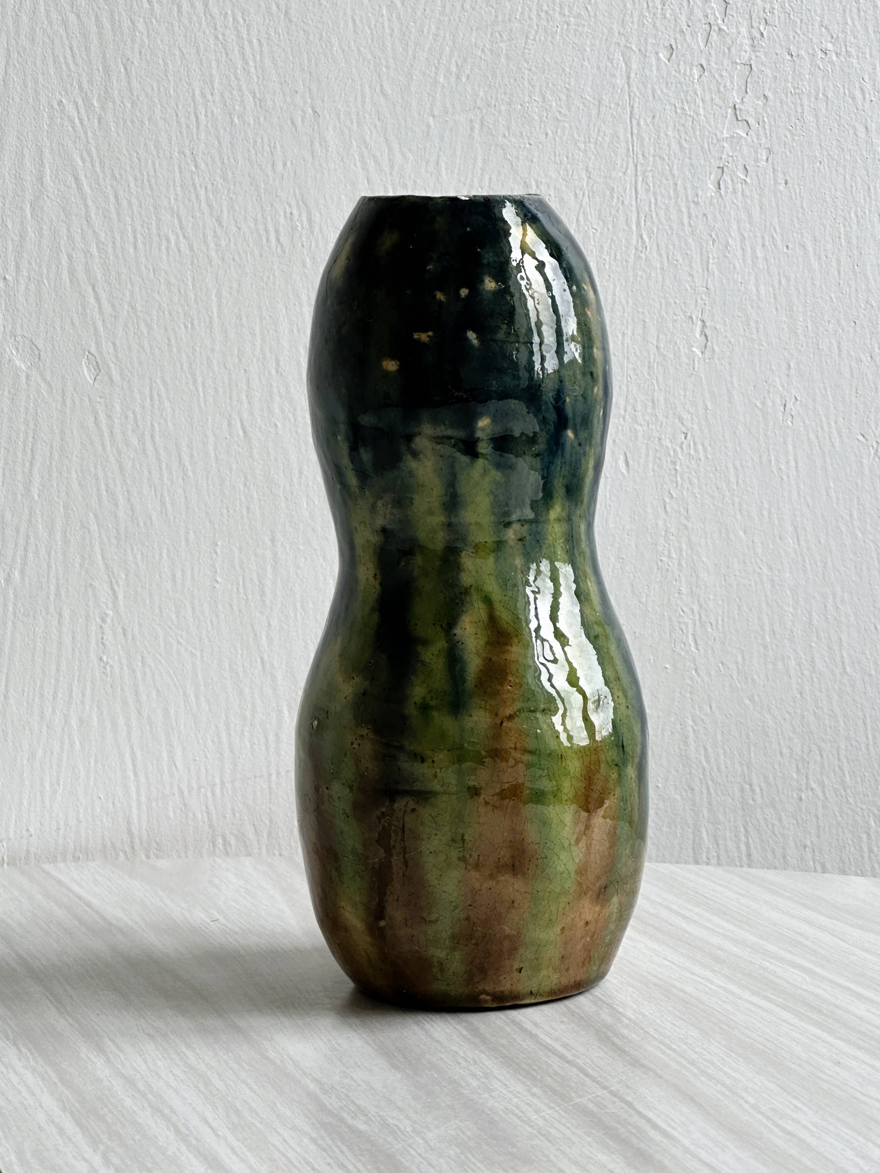 Very colorful glazed earthenware vase, old vase with floral decoration.
