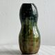 Very colorful glazed earthenware vase, old vase with floral decoration.