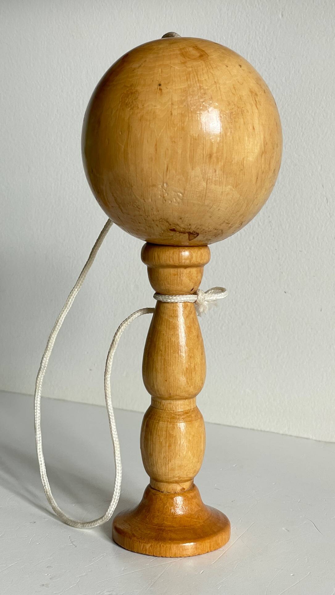 Vintage wooden cup-and-ball toy