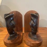 Pair of bronze bookends with masks