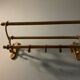 Antique brass coat rack and wall-mounted hat holder